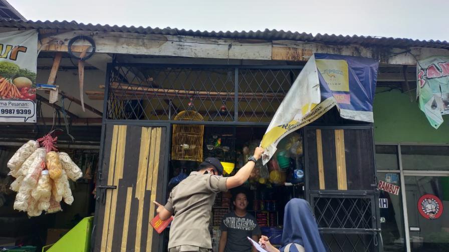 Tobacco advertising is removed from a storefront